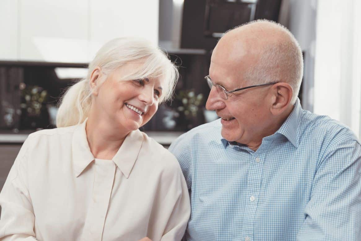 Senior couple enjoying their apartment and the benefits of senior living.
