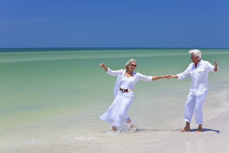 Residents of a continuing care retirement community enjoying their time on the beach together.