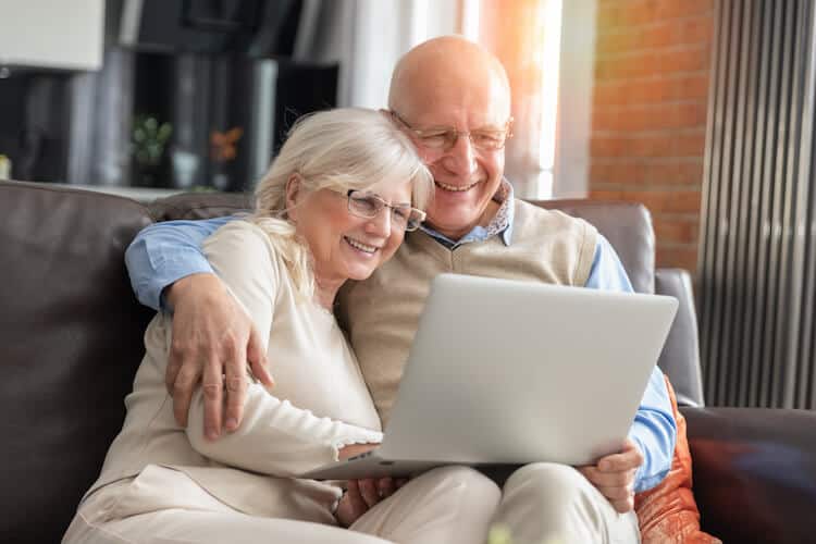 Senior couple browsing the internet together.