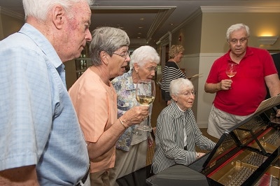 Engaged group of seniors enjoying life at a continuing care retirement community