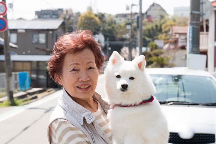 Senior woman with dog.