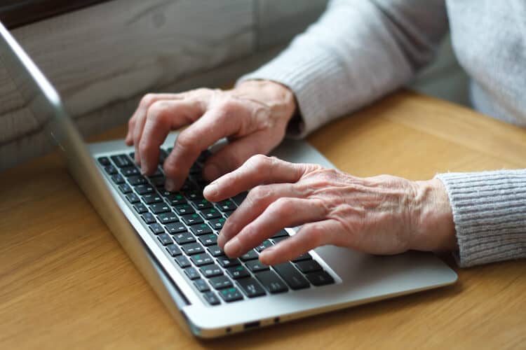 Senior female researching online.