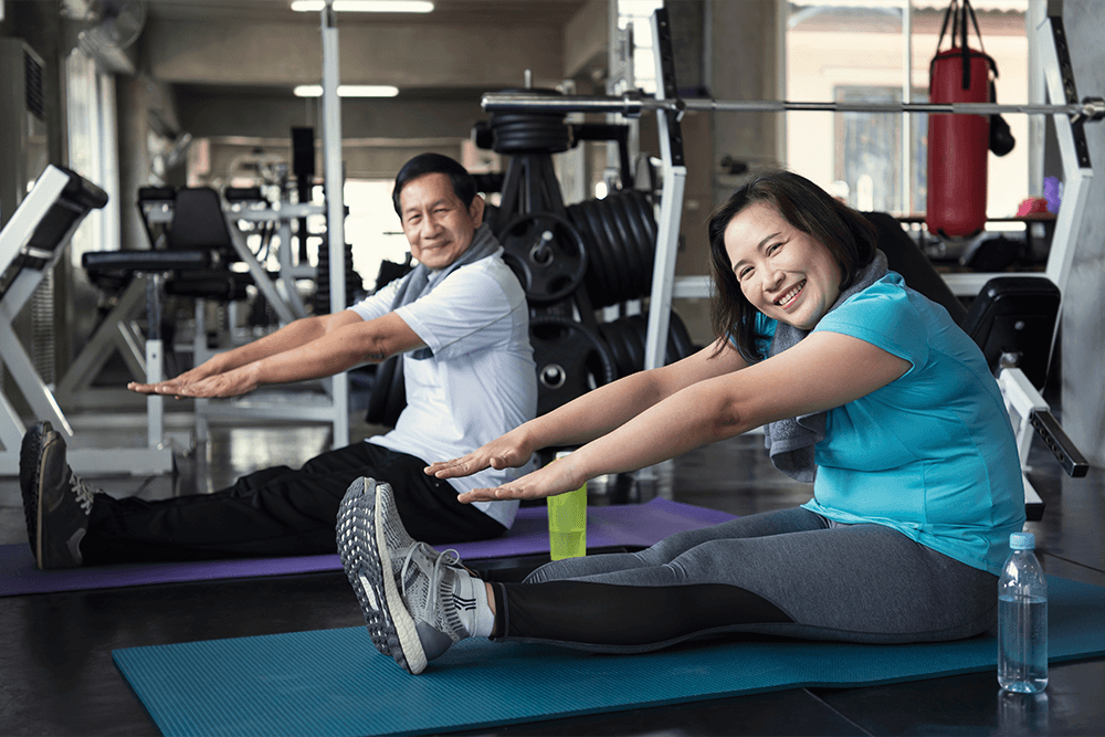 Couple exercising at the gym.