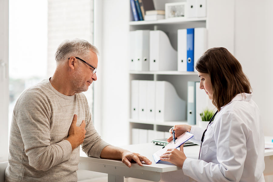 Senior man reviewing results with doctor in an office