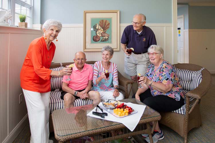 Group of adults socializing at a senior living community