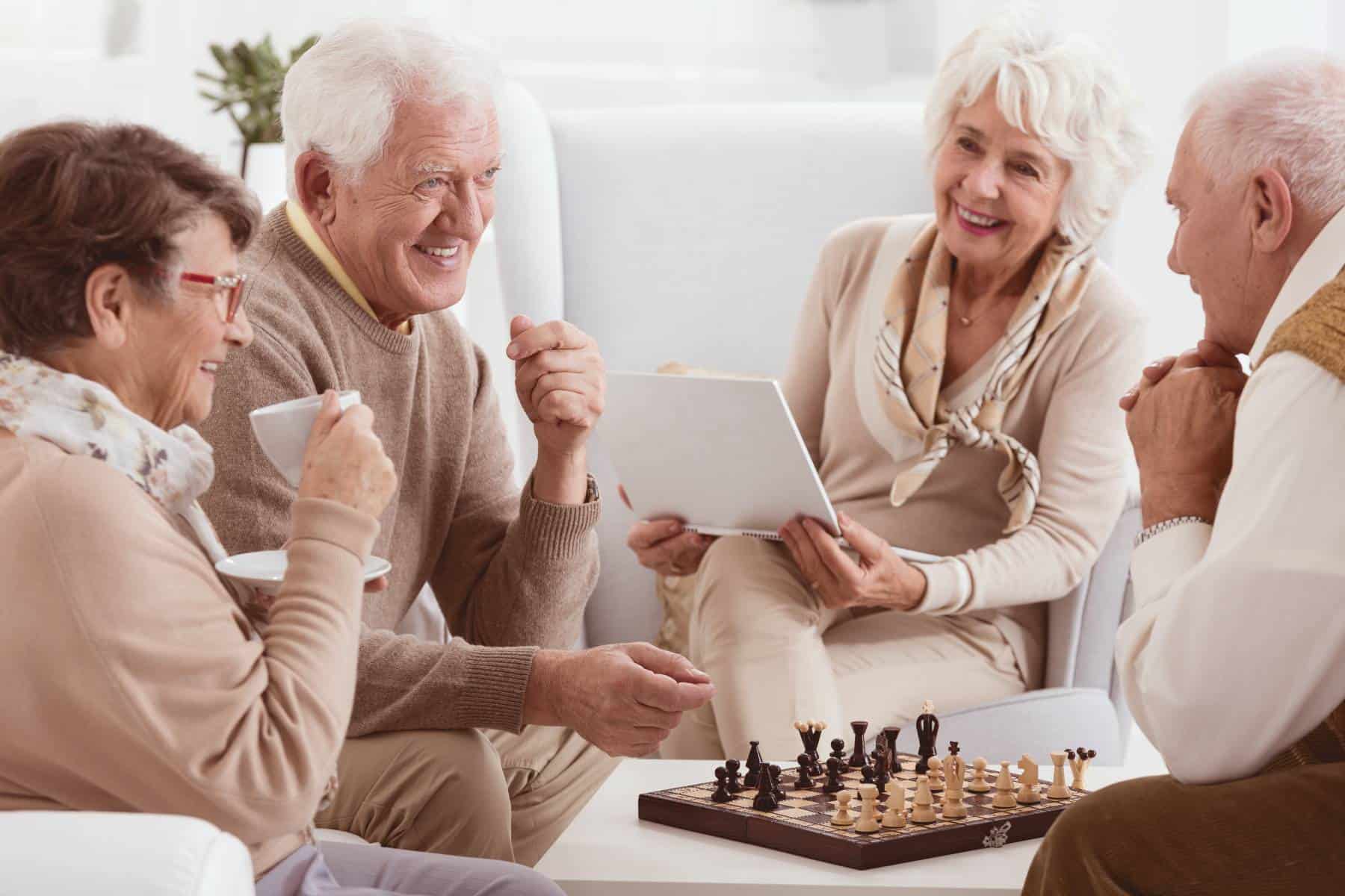 seniors gathered playing chess and talking