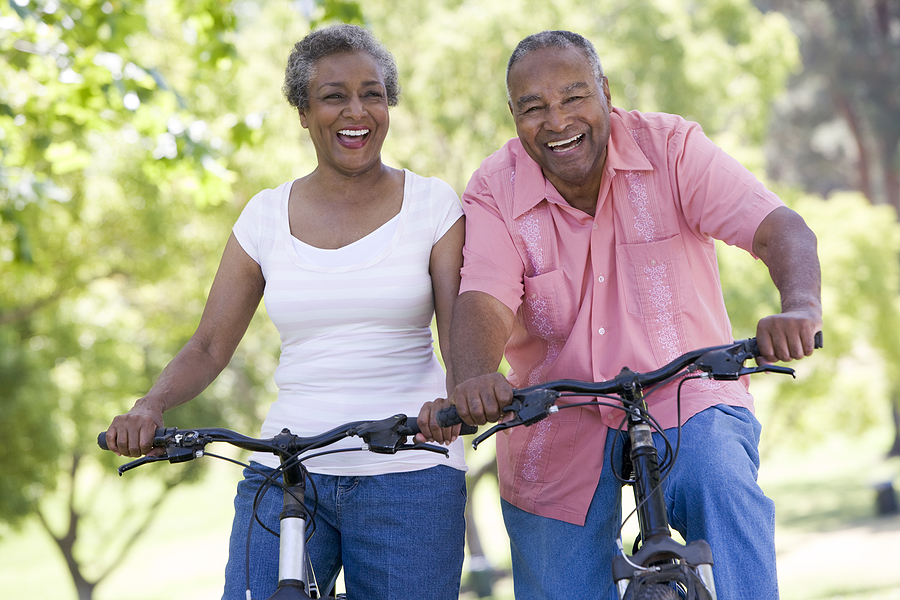A bicycling couple demonstrating a healthy lifestyle for seniors