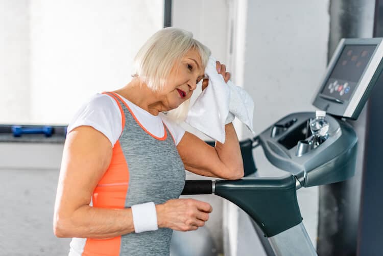 Senior woman on treadmill.