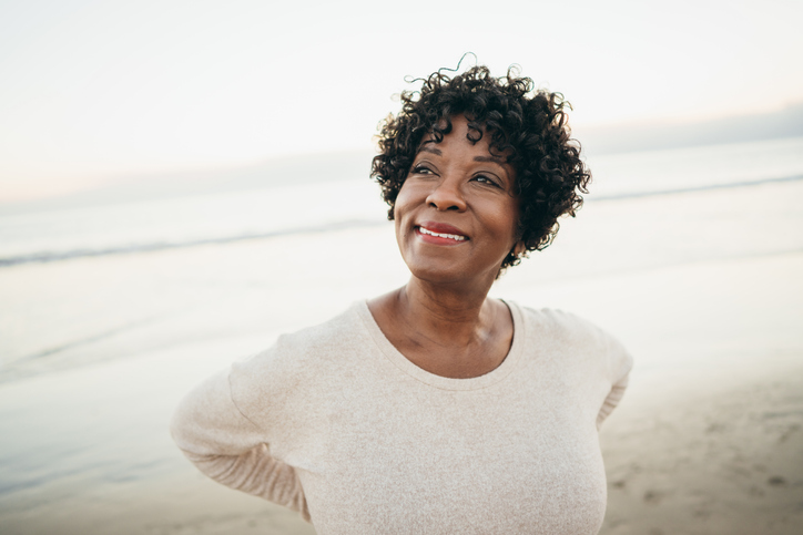 Senior Woman Smiling at Beach