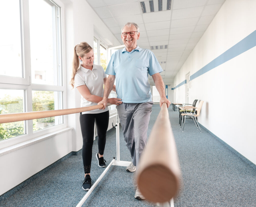 Physical Therapist Helping Senior Man with Balance