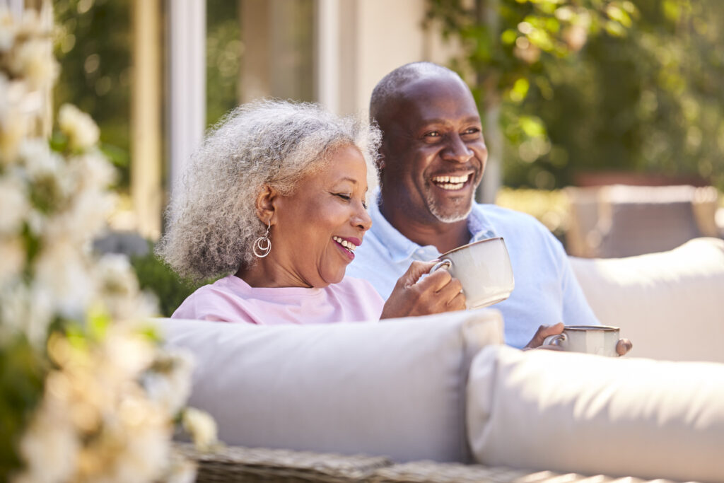 Senior Couple Smiling and Drinking Coffee