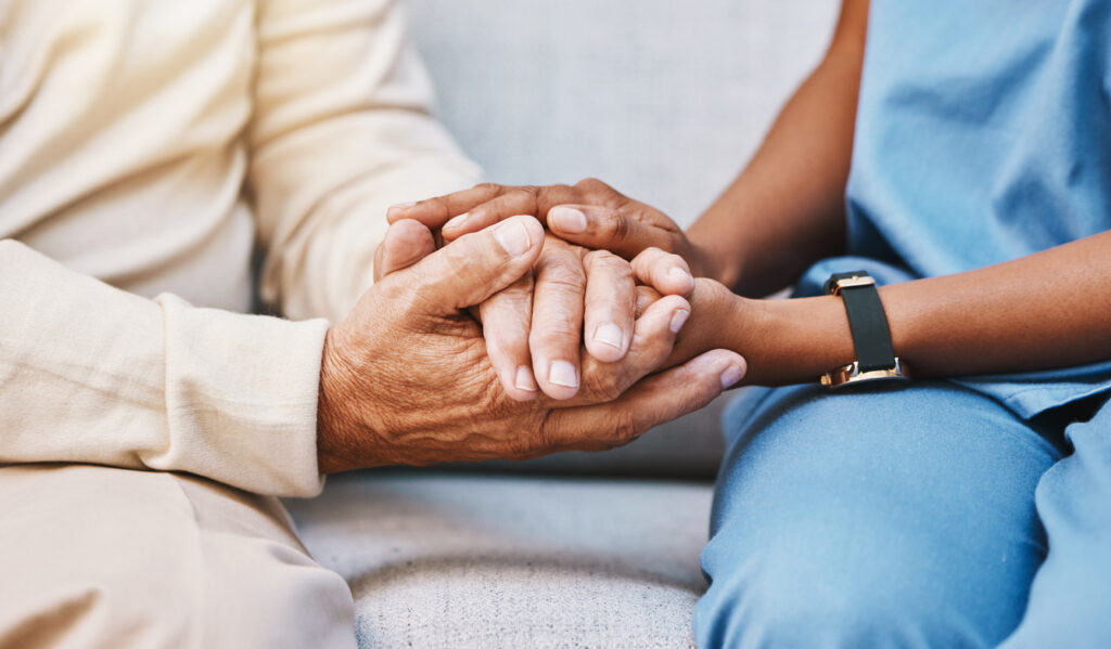 Nurse Holding Patient Hands