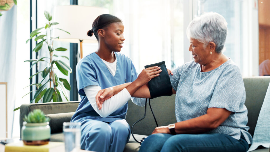 Nurse Checking Senior Woman's Bloop Pressure