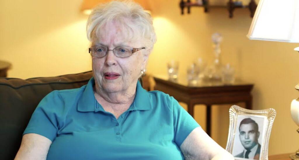 woman in teal blue polo